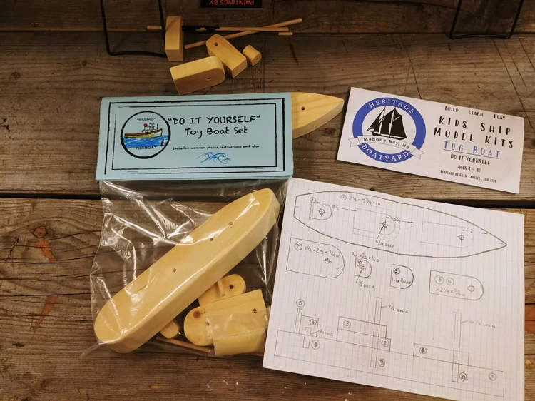 The Heritage Boatyard kids' Do-It-Yourself tug boat model kit with wooden pieces and instructions