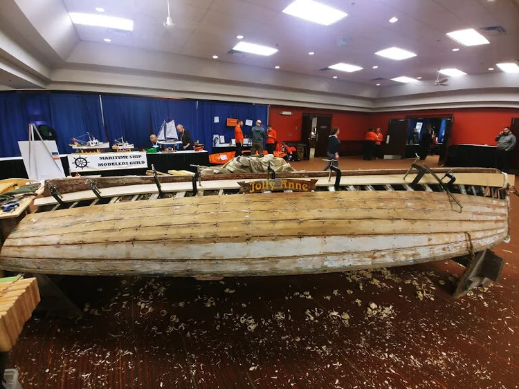 The Jolly Anne skiff on display at the Halifax International Boat Show with the carved name board on her stern